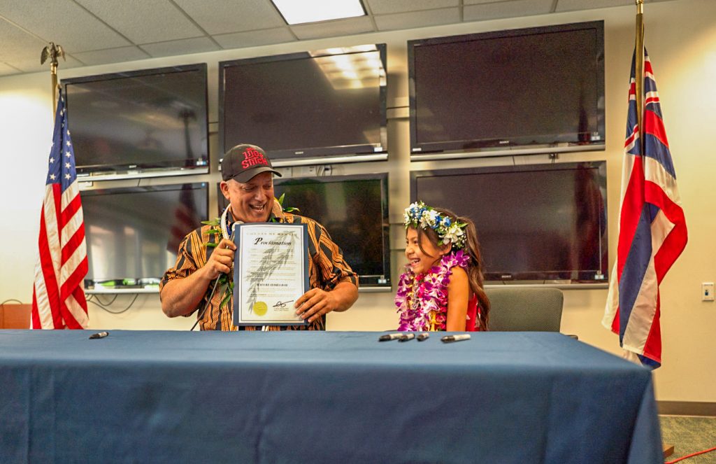 Hawai‘i County Mayor Kimo Alameda sits with "Lilo & Stitch" star Maia Kealoha, declaring June 3, 2025, Maia Kealoha Day. (Tiffany DeMasters/Big Island Now)