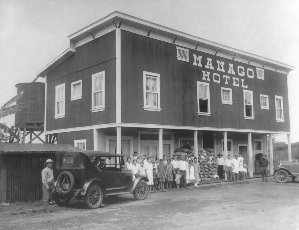 Friends and workers sitting in front of the Manago Hotel, circa the 1920s. (Photo Courtesy: Manago Hotel website)