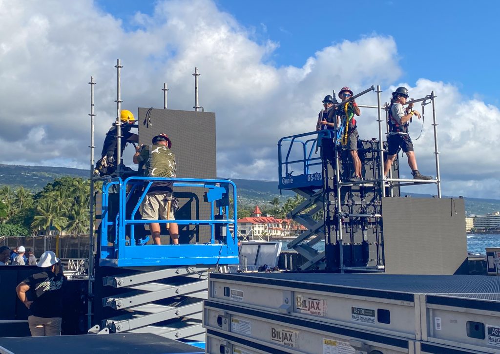 Workers on Thursday put together the finish line for the 2024 VinFast Ironman World Championship. (Cammy Clark/Big Island Now)