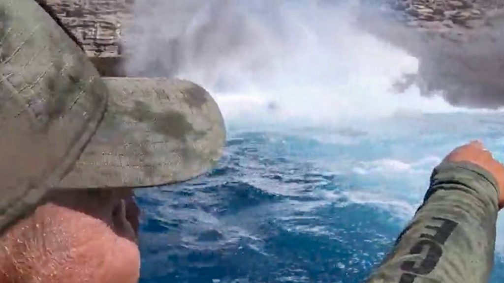 Lt. Vance Lime of the state Division of Conservation and Resource Enforcement points out the dangers of the ocean's powerful waves during a safety video. (Screen shot courtesy Department of Land and Natural Resources)