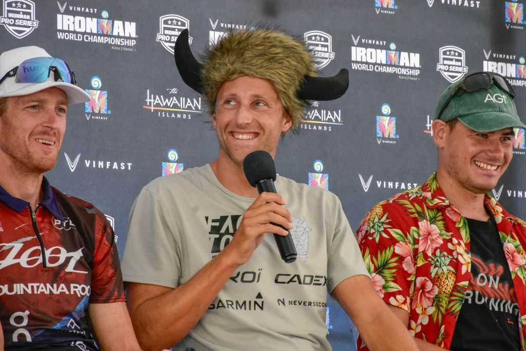 American Rudy Von Berg talks about the origin of his bison headwear while fellow American Matt Hanson (left) and Norwegian Gustav Iden chuckle during a pre-race press conference for the Ironman World Championship in Kona. (Cammy Clark/Big Island Now)